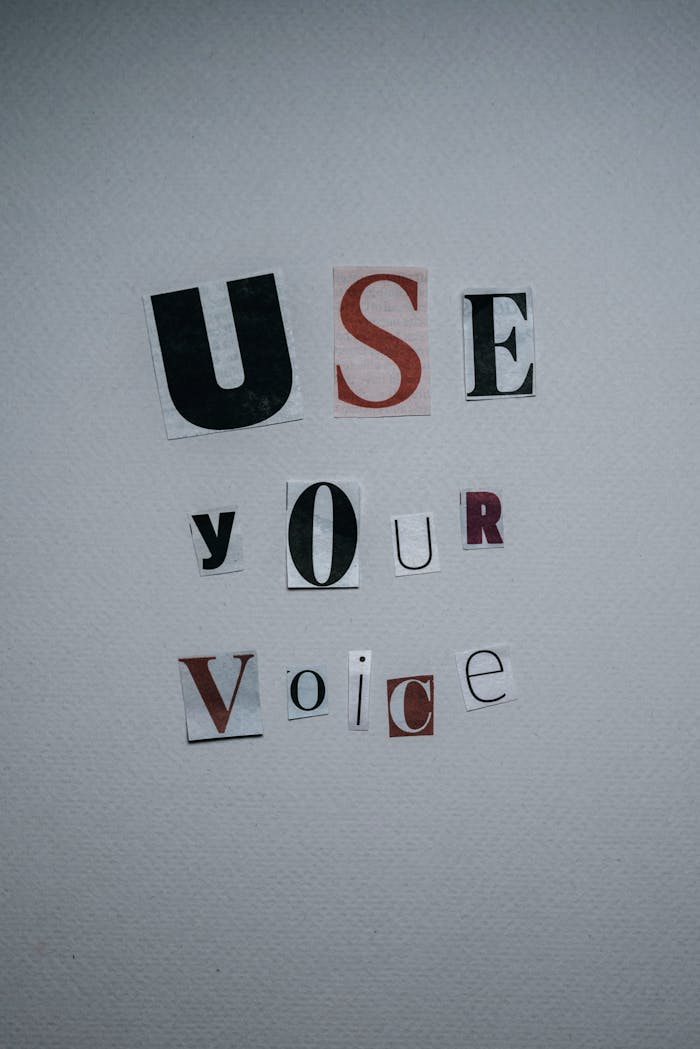 Inspirational text on wall spelling out "Use Your Voice" with creative typography.